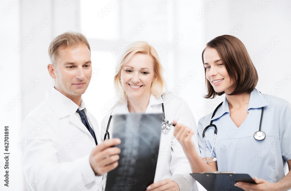 doctors looking at x-ray doctors looking at x-ray