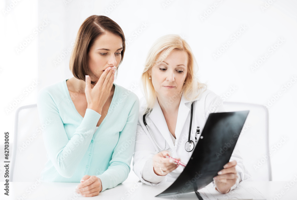 doctor with patient looking at x-ray doctor with patient looking at x-ray