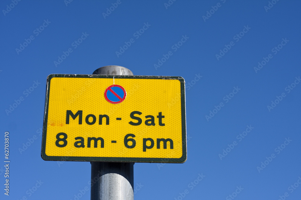 Yellow no parking sign between Monday and Saturday 8am - 6pm Yellow no parking sign between Monday and Saturday 8am - 6pm