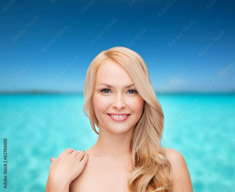 face and shoulders of happy woman with long hair