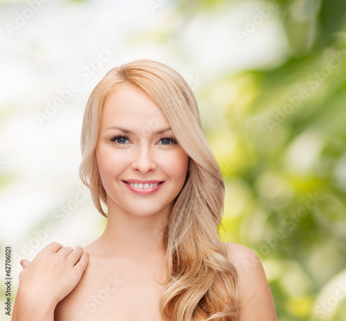 face and shoulders of happy woman with long hair