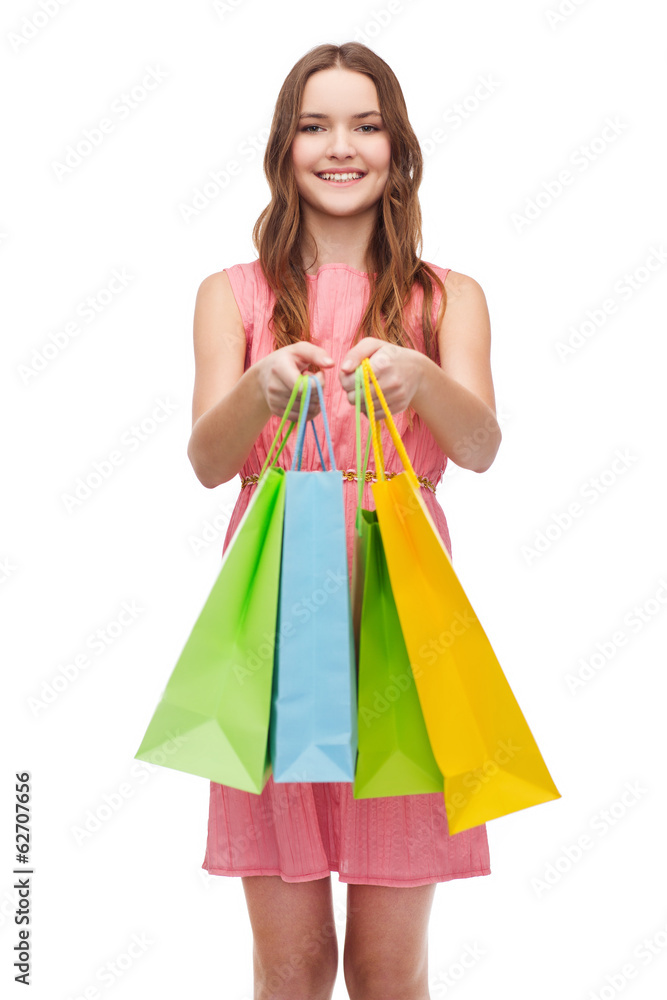 smiling woman in dress with many shopping bags
