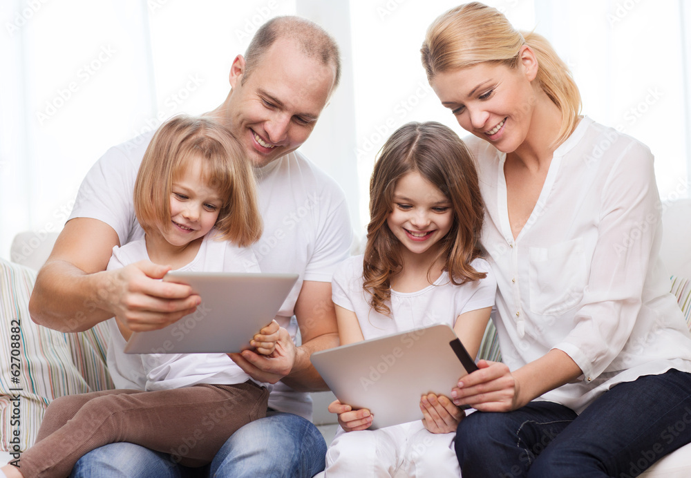 family and two kids with tablet pc computers family and two kids with tablet pc computers