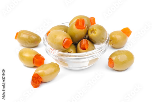 stuffed green olives in glass  isolated on white   background