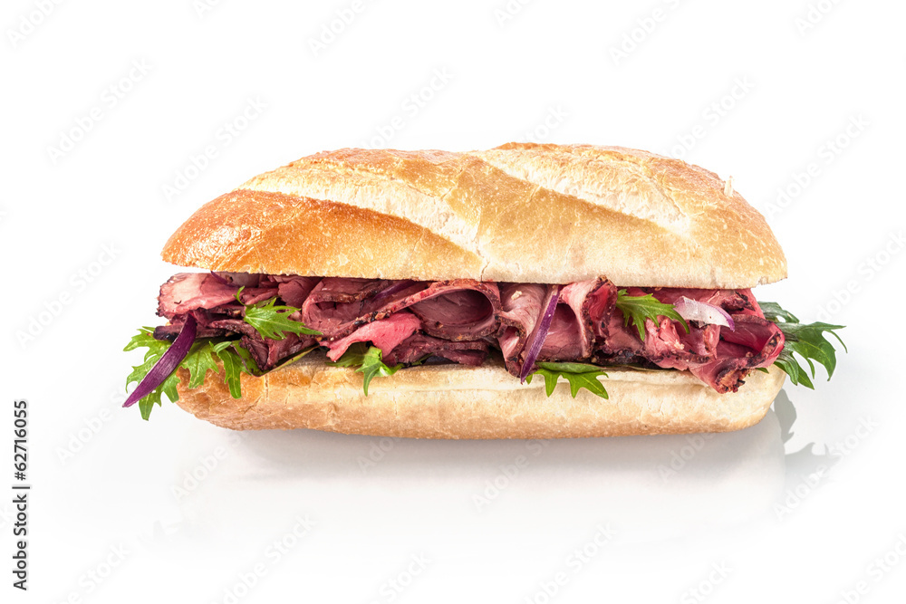 Rare roast beef and fresh rocket on a baguette