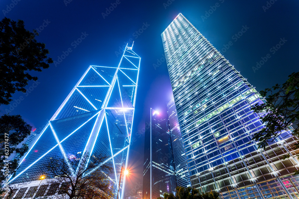 Naklejka premium modern buildings of the city at night