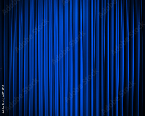 blue closed curtain with light spots in a theater