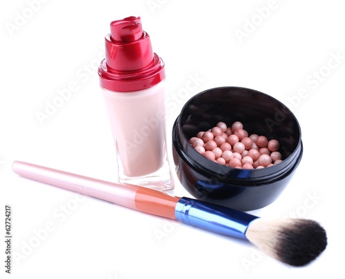 Composition with concealer, powder balls and brush isolated