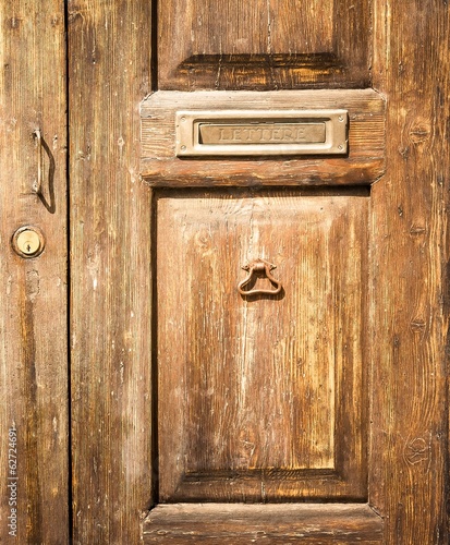 old wood door with postbox