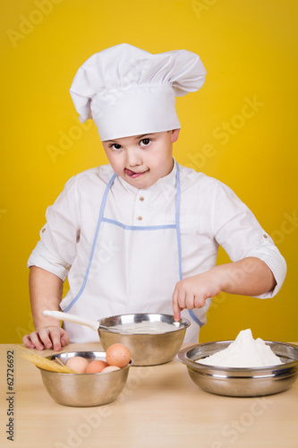 Little boy chef in uniform