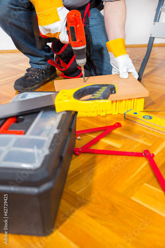 Male Worker laminate, parquet flooring