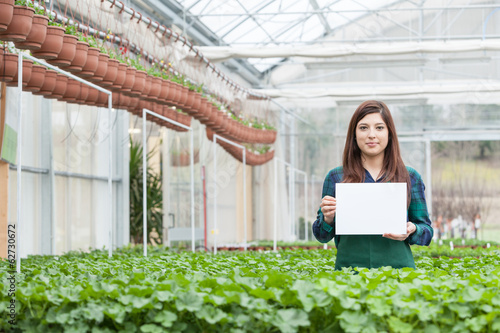 Female Garden Worker Holding an blank paper