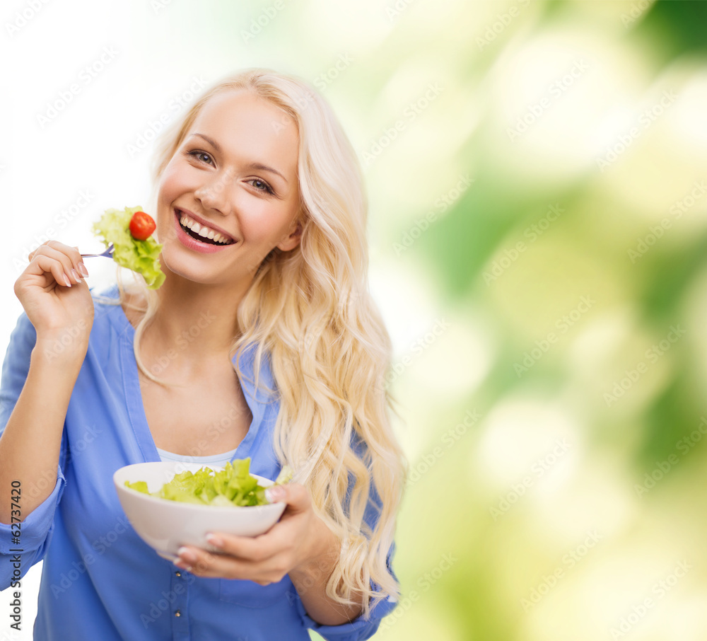 smiling young woman with green salad smiling young woman with green salad