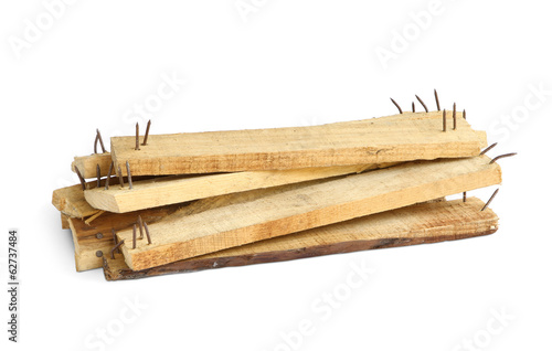 Wood scrap with sharp nails isolated on white background