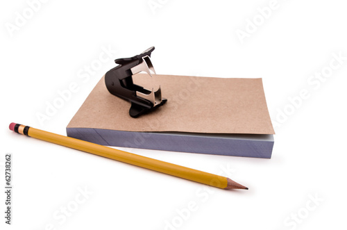 staple remover, pencil and notepad photo