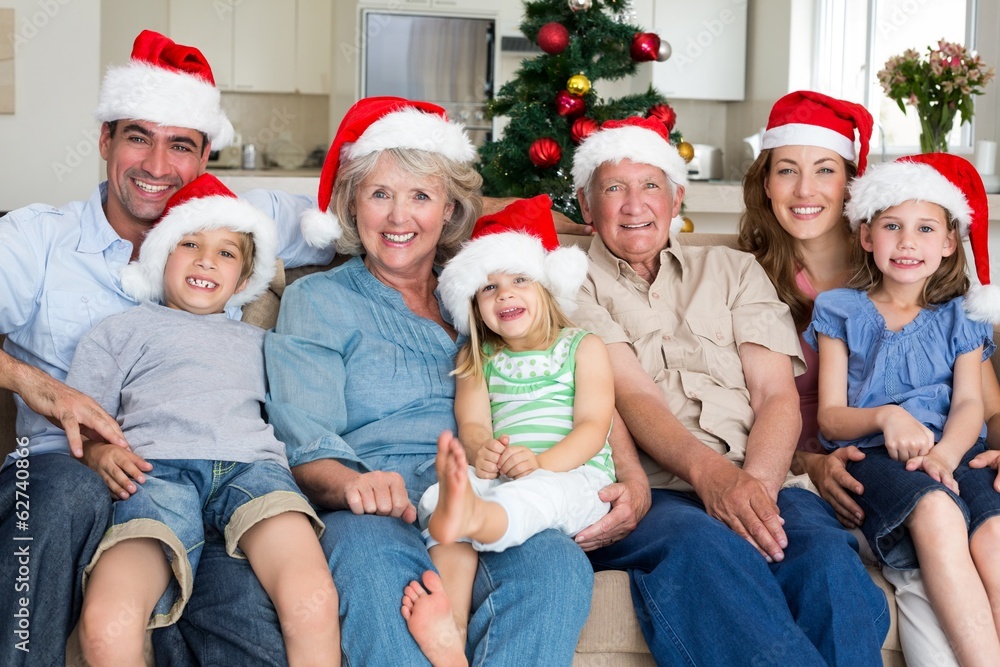 Family in Santa hats celebrating Christmas Family in Santa hats celebrating Christmas