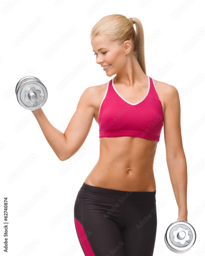 smiling woman lifting steel dumbbell smiling woman lifting steel dumbbell
