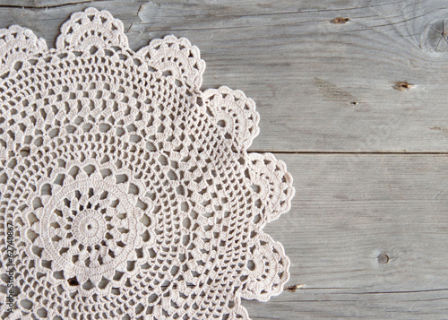 Crochet doily over old grey wood