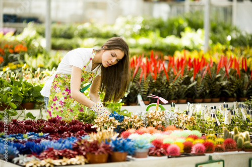 Young woman in flower garden