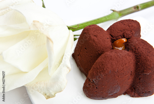 Chocolate cake and white rose..