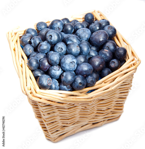 The basket full of a ripe blueberry