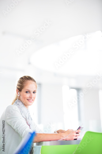 Student on campus - pretty, female student with books