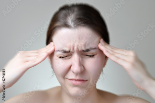 Wallpaper Mural Young woman having headache Torontodigital.ca