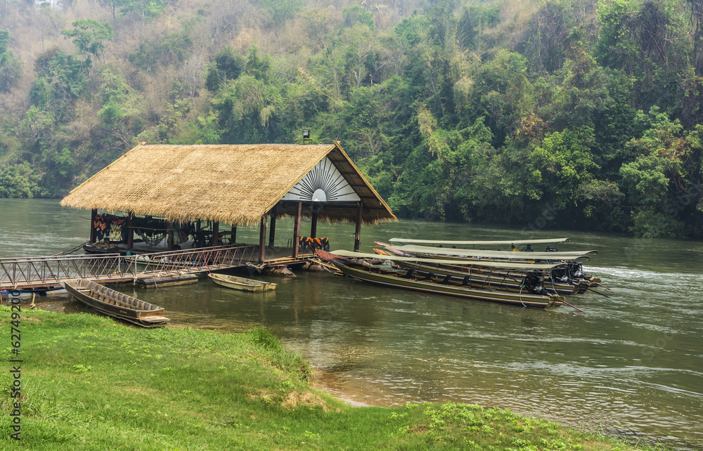 Long-tail boats in River Kwai Long-tail boats in River Kwai