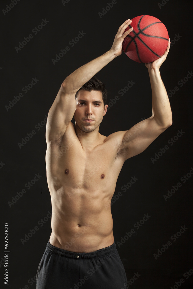 man working out with his medicine ball on black background man working out with his medicine ball on black background