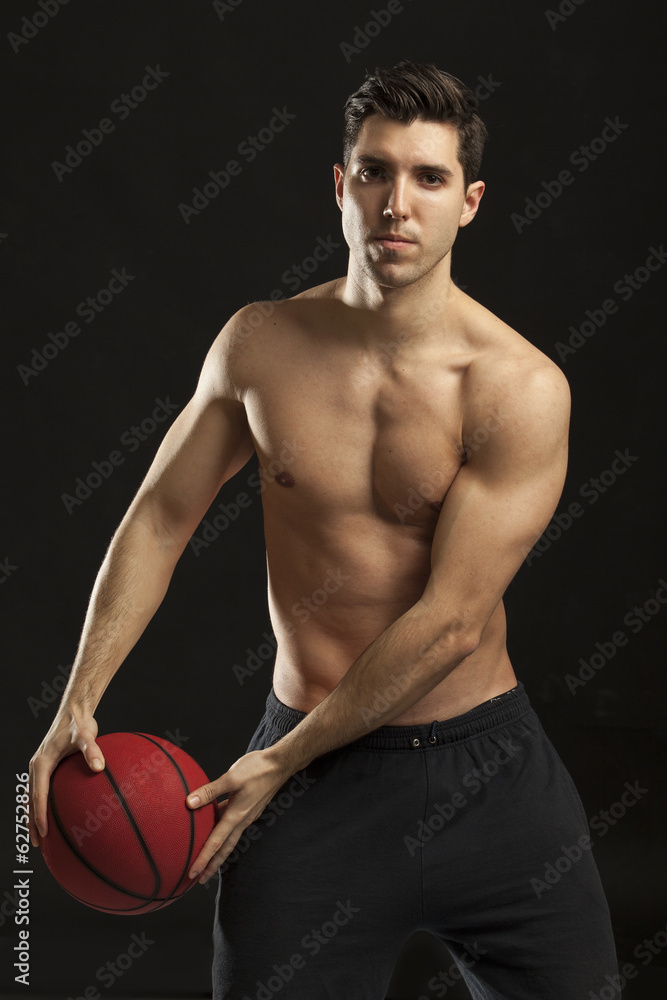 man working out with his medicine ball on black background man working out with his medicine ball on black background
