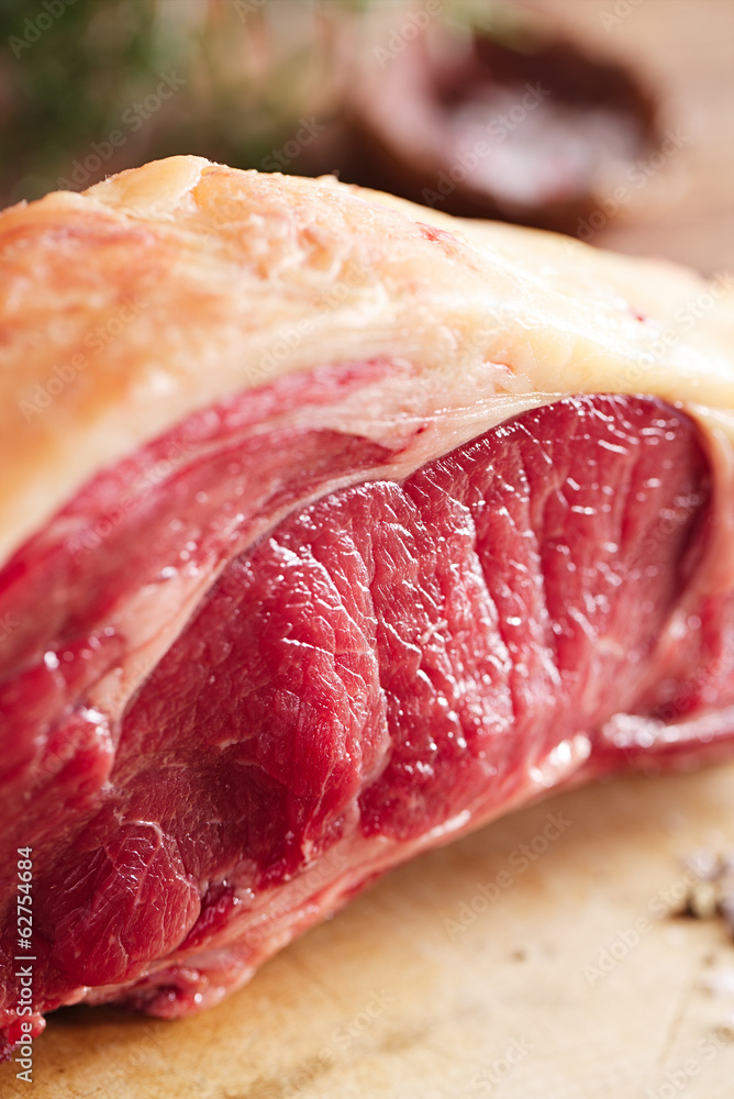 raw beef Rib steak with bone on wooden board and table raw beef Rib steak with bone on wooden board and table