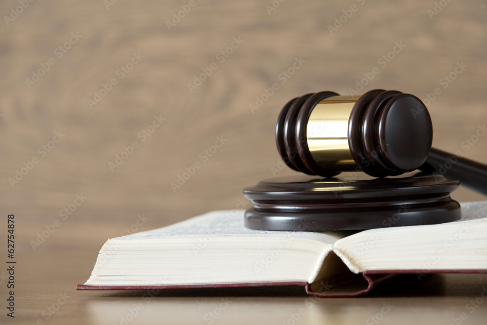 wooden gavel and books