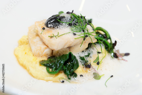 Steamed fish fillet with potato mash and herbs photo