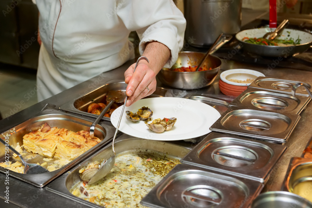 Chef is making a seafood dish