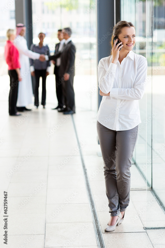 businesswoman talking on cell phone businesswoman talking on cell phone