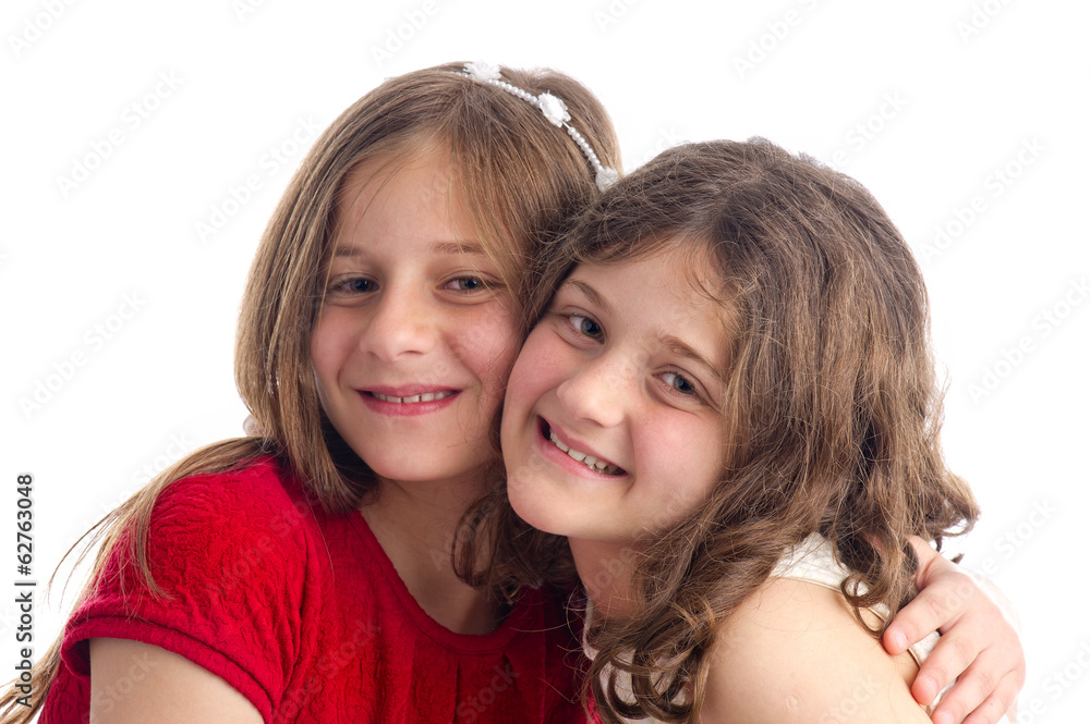 Two Beautiful Sisters hugging isolated on white Two Beautiful Sisters hugging isolated on white