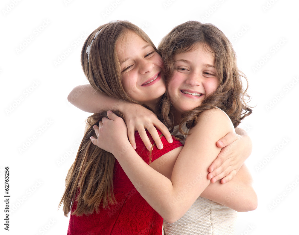 Two Beautiful Sisters hugging isolated on white Two Beautiful Sisters hugging isolated on white
