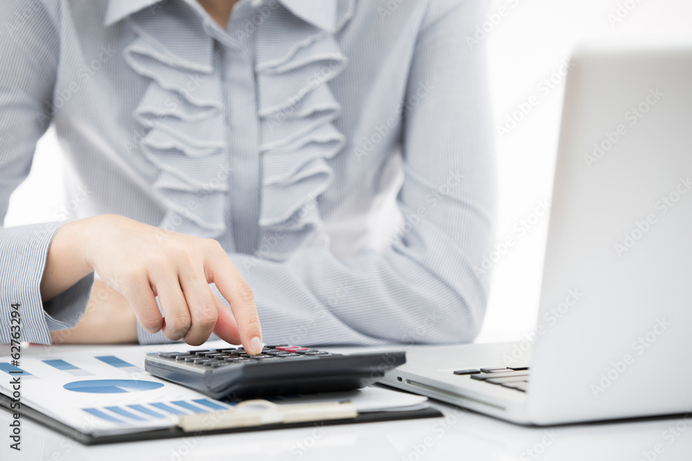 Business woman analyzing investment charts with laptop Business woman analyzing investment charts with laptop