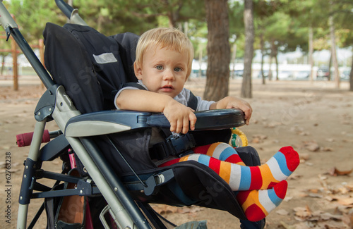 child in stroller photo