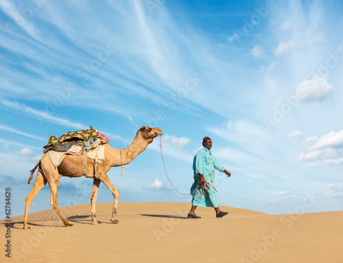 Cameleer  camel driver  with camels in Rajasthan  India