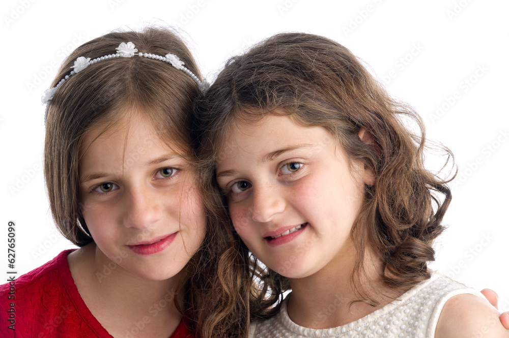 Two Beautiful Sisters hugging isolated on white Two Beautiful Sisters hugging isolated on white