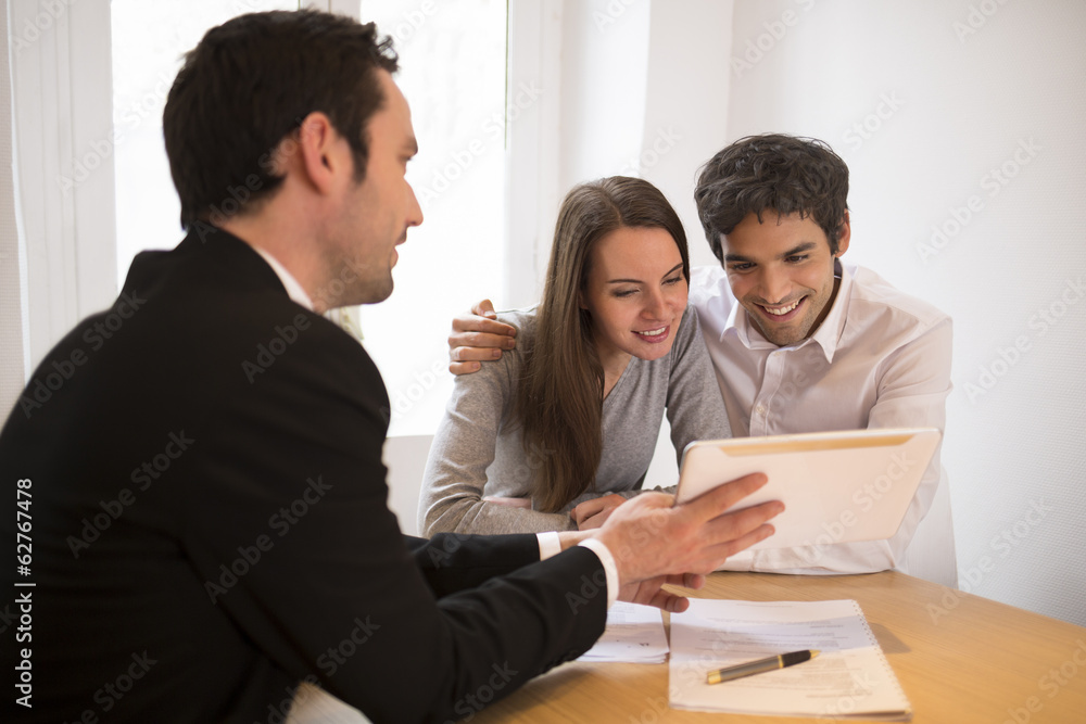 Young Couple meeting real-estate agent to buy property Young Couple meeting real-estate agent to buy property