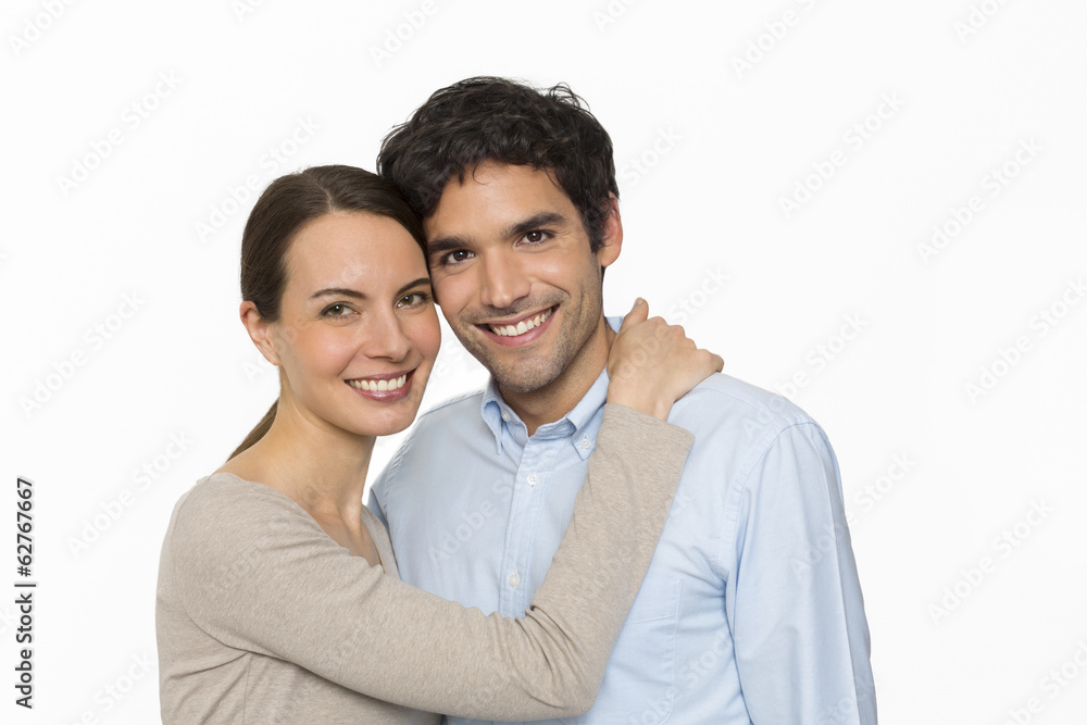 Happy young lover couple standing on white background, isolated Happy young lover couple standing on white background, isolated