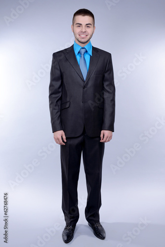 Business man on grey background