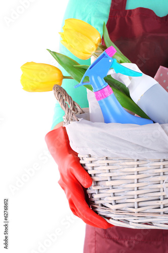 Fototapeta Naklejka Na Ścianę i Meble -  Housewife holding basket with cleaning equipment. Conceptual