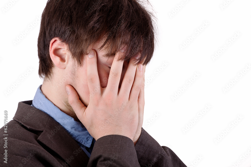 Young businessman examining contract in the office Young businessman examining contract in the office