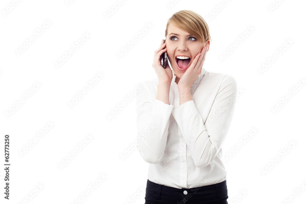 Surprised woman talking on phone Surprised woman talking on phone
