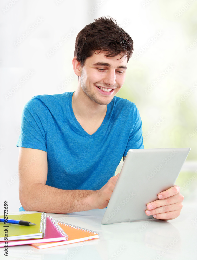 young student using tablet pc