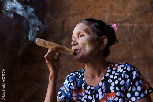 happy smoking old woman in myanmar