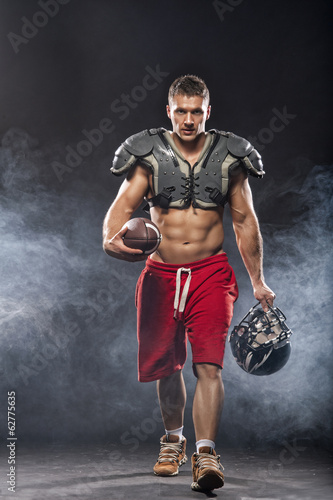 Fototapeta Naklejka Na Ścianę i Meble -  American football player posing